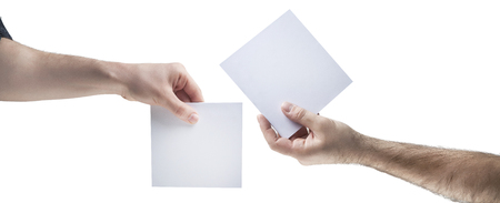 Hands holding, delivering blank piece of paperの写真素材