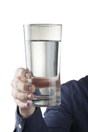 Male hand holding clear glass of waterの写真素材