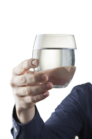 Male hand holding clear glass of waterの写真素材
