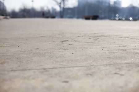 Close perspective of concrete floor, blurry backgroundの写真素材