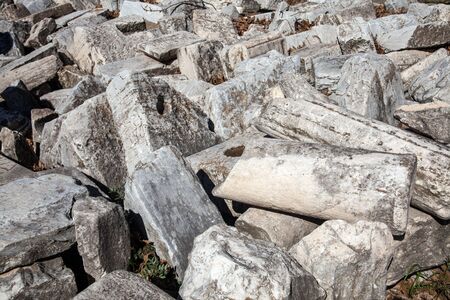 Pile of ancient temple parts and stonesの写真素材