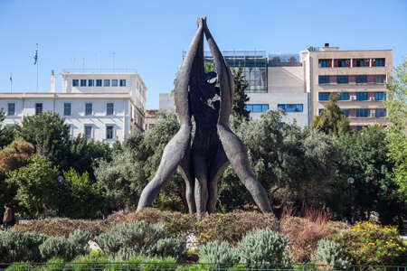 Athens Greece, April 17. 2018: Statue of âMemorial of National Reconciliationâ by Vassilis Doropoulos (1987) on Klafthmonos Squareのeditorial素材