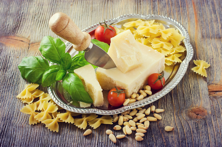 Composition with ingredients, pasta, parmesan cheese, basilic for pesto sauce, vintageの写真素材