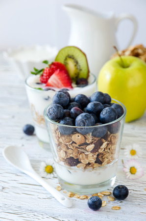 Granola or muesli with berries and fruits for healthy morning mealの写真素材