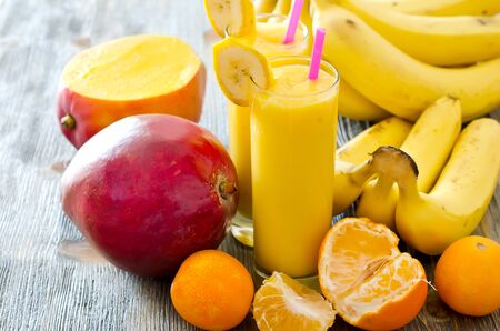 Healthy drink with fruits on wooden backgroundの写真素材