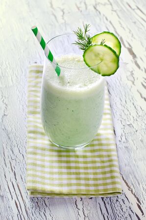 Cold green vitamin detox cucumber drink with dill verticalの写真素材