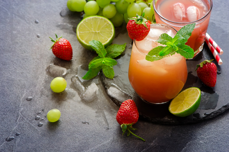 Strawberry summer refreshing drink with ice cubes, lime, mint. Home-made lemonadeの写真素材