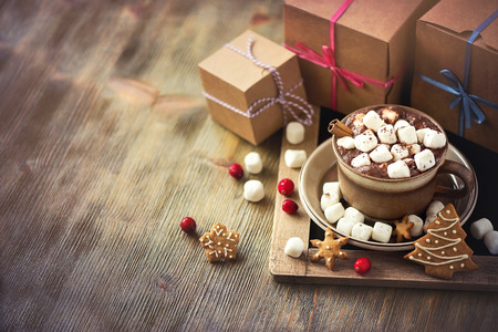 Winter hot drink, cacao with marshmallows and christmas cookies, spicy hot chocolate copy space festive vintage backgroundの写真素材