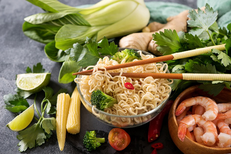 Chinese noodles with shrimps and vegetables in jar, fast lunch, asian food with chopsticks, asian, chinese or thai foodの写真素材