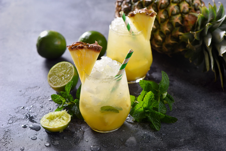 Cold pineapple cocktail with crushed ice, lime and mint, refreshing lemonade drinkの写真素材