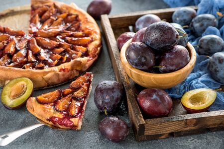 Homemade plum pie, autumn dessert with fresh plums, baking, healthy vegetarian foodの写真素材
