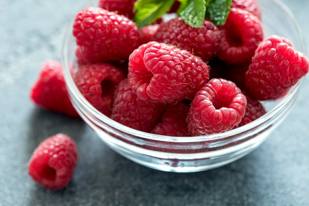 Fresh raspberries, healthy berries, close up, vegan concept, food backgroundの写真素材