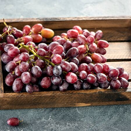 Grapes in wooden box, autumn organic harvest, healthy eating, fresh vegan vitamins, squareの写真素材