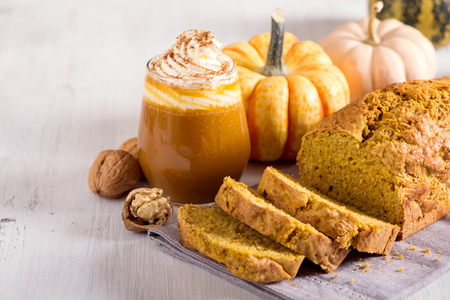 Pumpkin bread cake with pumpkin latte for autumn fall dinnerの写真素材