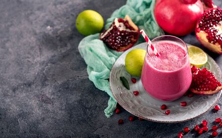 Pomegranate smoothie, healthy vegan vitamin drink with fresh ingredients copy spaceの写真素材