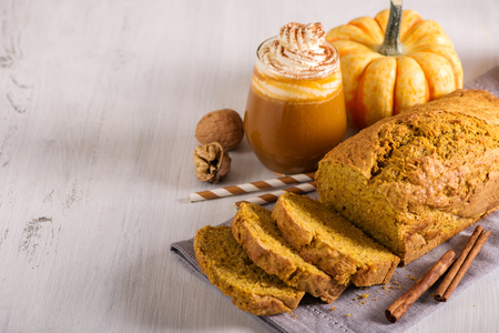 Pumpkin bread cake with pumpkin latte for autumn fall dinnerの写真素材