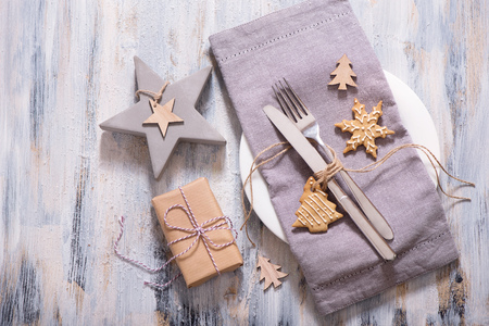 Christmas table setting with christmas star decoration, present box and gingerbread cookie copy spaceの写真素材
