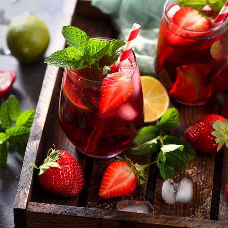 Strawberry lemonade, refreshing summer drink with strawberries, lime and mint, square imageの写真素材