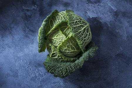 Savoy cabbage, healthy vegan cooking ingredient, fresh vegetable copy space text backgroundの写真素材