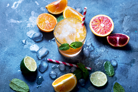 Refreshing cocktail with crashed ice, juicy summer party drink with citrus fruitsの写真素材