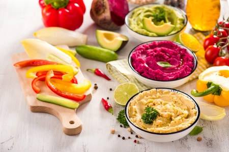 Colorful hummus, different dips, vegan snack, beetroot and avocado hummus, vegetarian eatingの写真素材