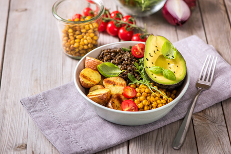 Buddha bowl with baked potatoes, lentils and spicy chickpeas, avocado, arugula, vegan, vegetarian healthy foodの写真素材