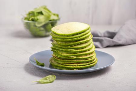 Green pancakes with spinach, healthy snack, vegetarian foodの写真素材