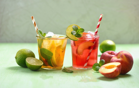 Iced tea, summer refreshment drink or cocktails, lemon, peach and lime teadの写真素材