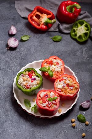 Stuffed peppers or paprika with rice and chickpeas, vegetarian lunch, vegan cooking, healthy eating; top viewの写真素材