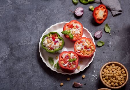 Stuffed peppers or paprika with rice and chickpeas, vegetarian lunch, vegan cooking, healthy eatingの写真素材