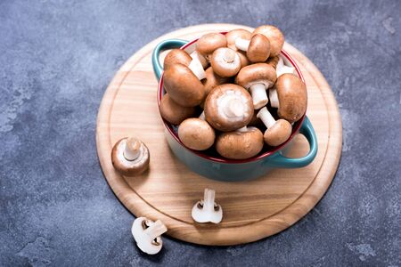 Brown champignons in bowl for cooking, vegan ingredientsの写真素材