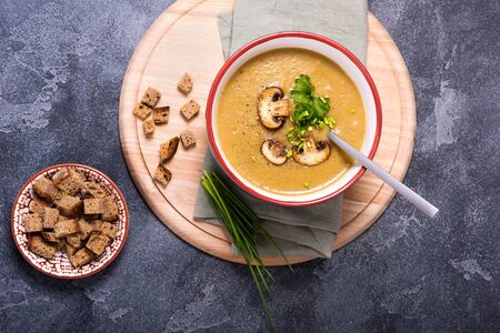 Champignon mushroom cream soup, delicious vegetable soup, healthy vegetarian and vegan foodの写真素材
