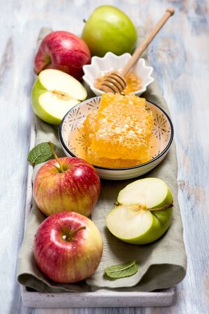 Honey combs and apples, rosh hashana, jewish new year celebration, traditional foodの写真素材