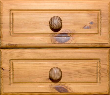 Two wooden drawers with knobs
