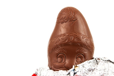 Chocolate Santa Claus in front of a white backgroundの写真素材