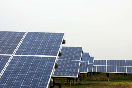 Park with solar cells in front of a overcast sky
