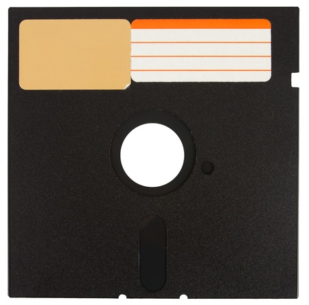 Front of a black floppy disk with labels over a white backgroundの写真素材