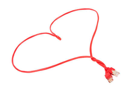 Red heart shaped network cable over a white backgroundの写真素材