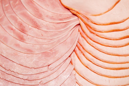Closeup of sliced boiled ham and smoked pork chopの写真素材