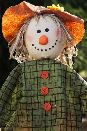 Closeup of a scarecrow with sunlight in the gardenの写真素材