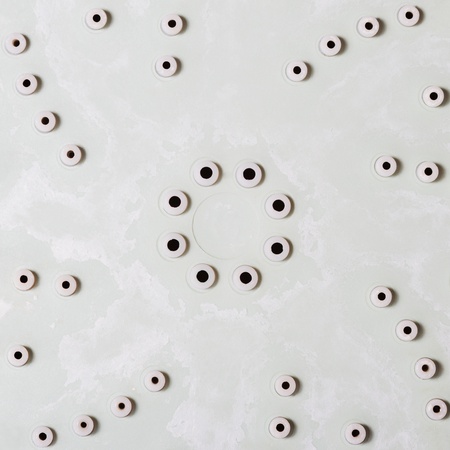 Abstract closeup of a shower head with calcareous depositsの写真素材