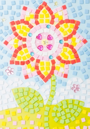 Colorful tinkered flower with many small sponge squaresの写真素材