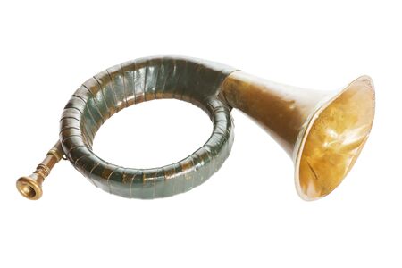 Old brass bugle with green leather over a white backgroundの写真素材