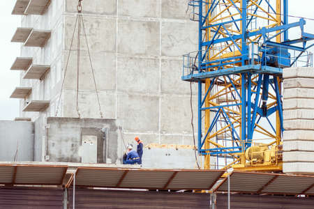 Builders work at the construction siteの写真素材
