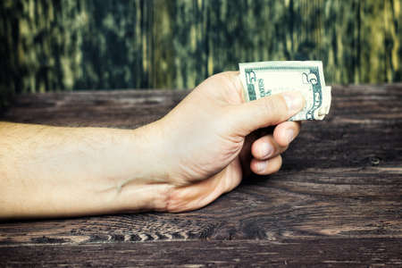 The hand offers dollars. bribe. corruuption.の写真素材