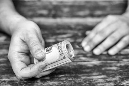 Male hand with a bundle of money.の写真素材