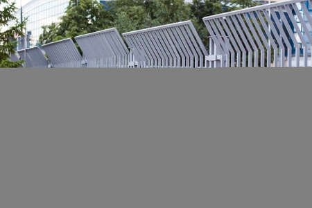 Metal fence in the city at the football stadium.の写真素材