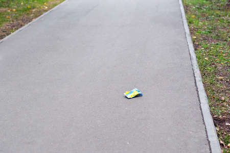 Garbage on the footpath in the park.の写真素材