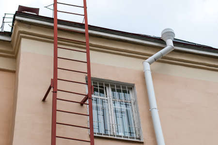 Metal ladder to the roof of the house.の写真素材