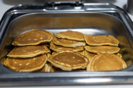 Plate with pancakes in a restaurant. Healthy food for breakfast.